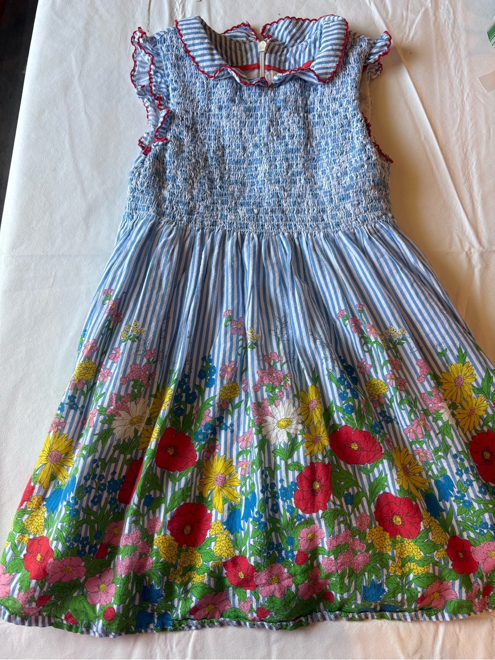 Mini Boden smocked dress blue-and-white striped pattern, vibrant floral hem 5/6